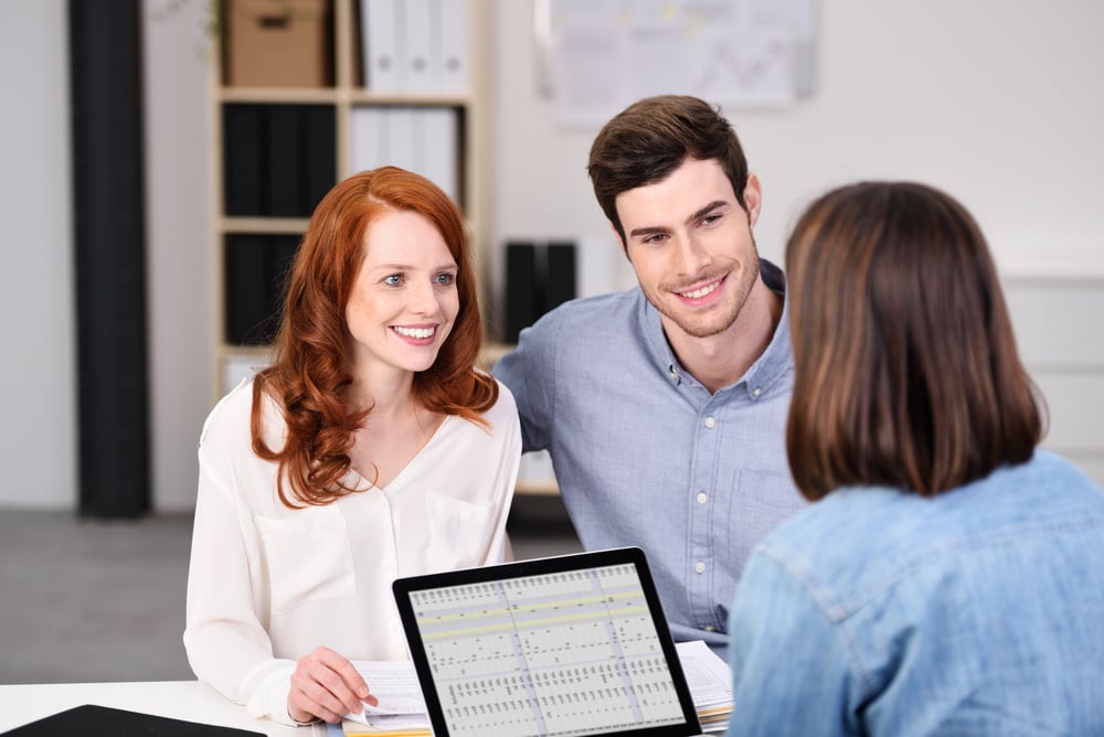 Close up Happy Young Couple Listening to a Businesswoman Talking About Plans at the Worktable Inside the Office.-Feb-14-2025-04-37-27-4693-PM