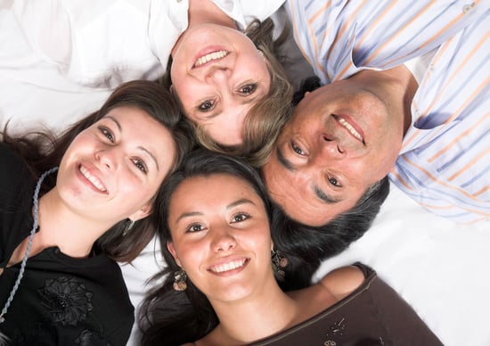 beautiful family - heads together on the floor
