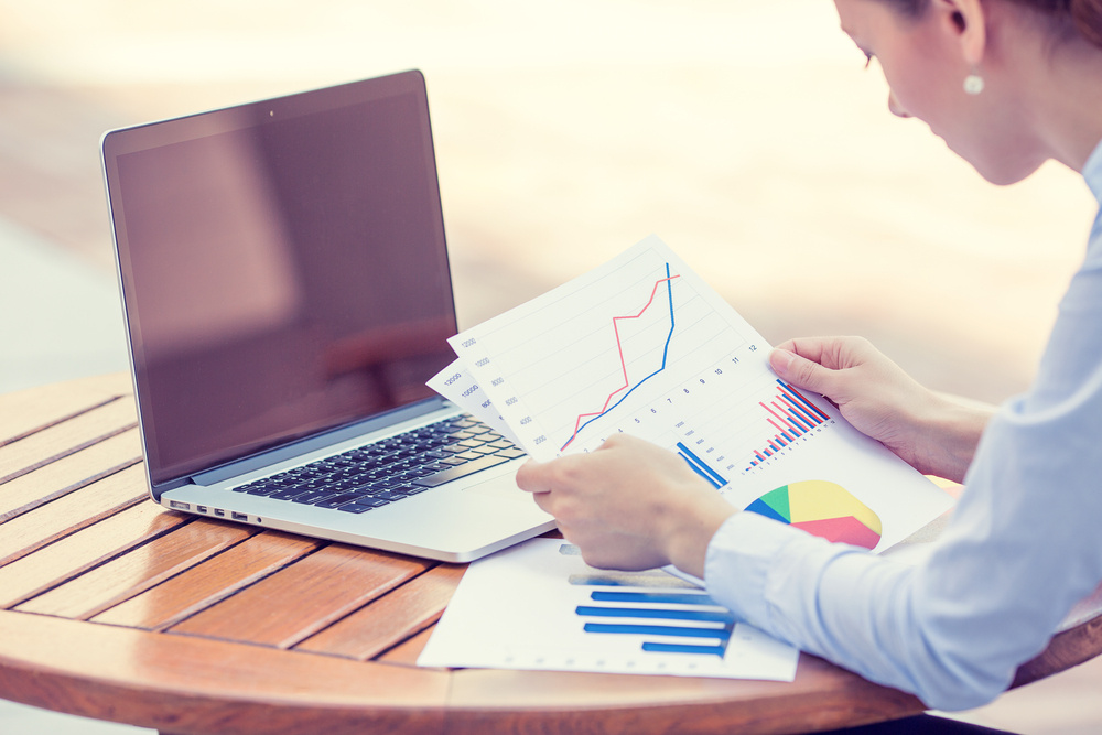 woman investment consultant analyzing company annual financial report balance sheet statement working with documents graphs. Stock market, office, tax, education concept. Hands with charts papers-4